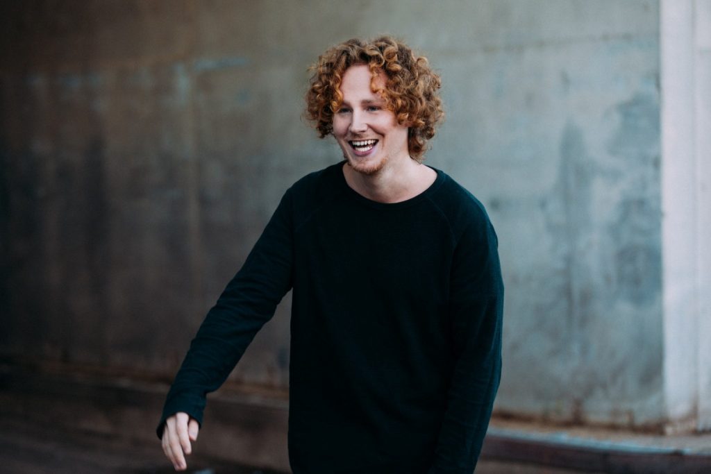 Michael Schulte wearing a black jumper