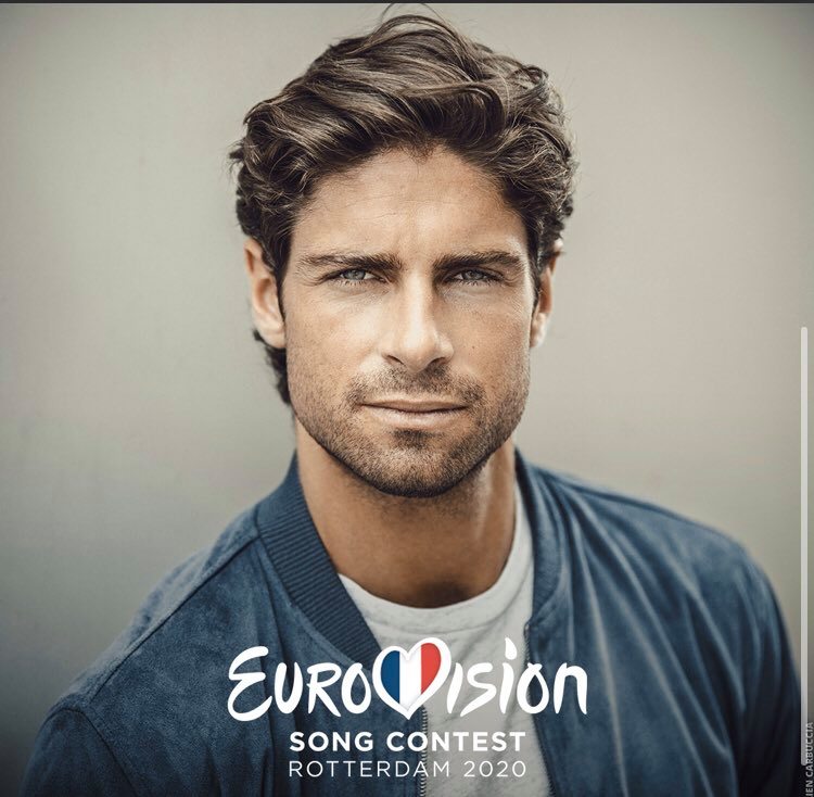 Eurovision 2020 French representative Tom Leeb, wearing a blue jacked, facing the camera