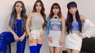 4th Impact posing for a photo, wearing blue