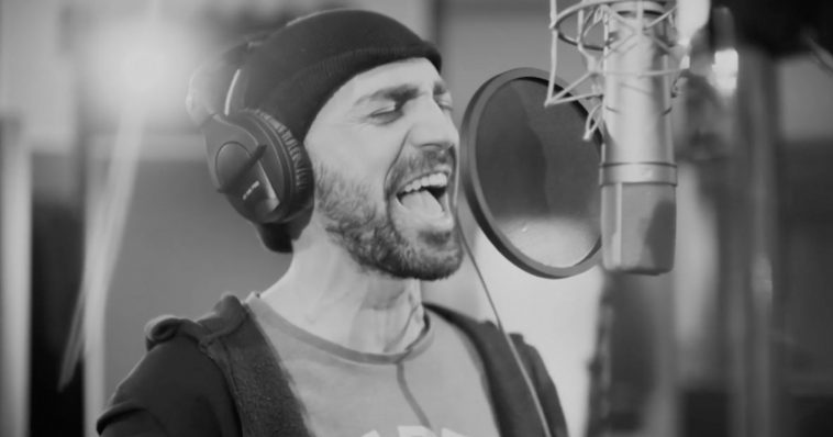 Tornike Kipiani singing his Eurovision 2020 song "Take Me As I Am" into a studio microphone