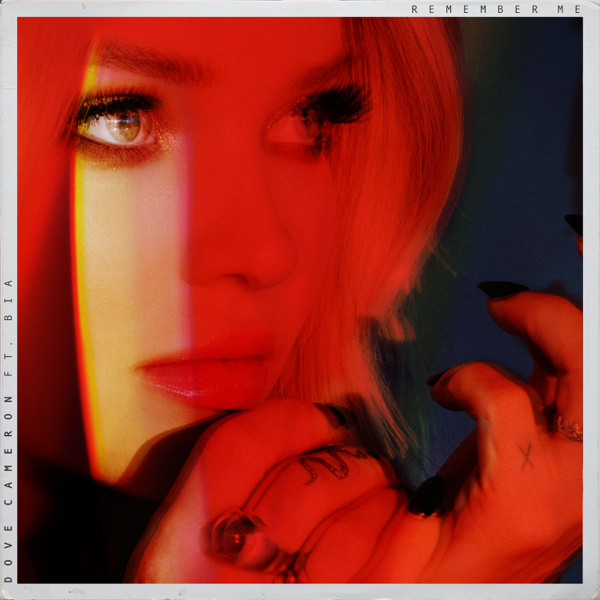 Dove Cameron single art work for "Remember Me" featuring BIA which sees Dove Cameron's face spotlighted with a red filter