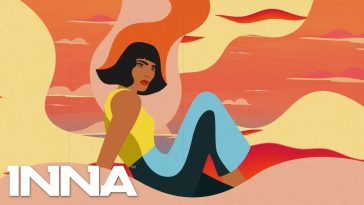 Still from the "Not My Baby" lyric video which sees INNA drawn as a cartoon lying on red sand wearing a yellow top and blue jeans.