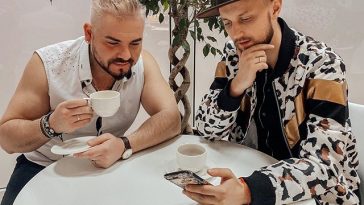 Sunstroke Project sitting at a table
