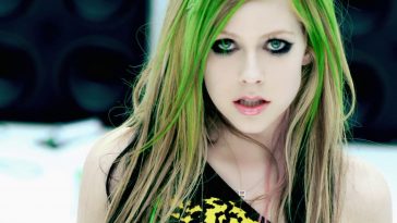 Still from one of Avril Lavigne;s Music Videos titled "Smile" where Avril Lavigne is seen wearing Abbey Dawn and with green streaks in her hair.