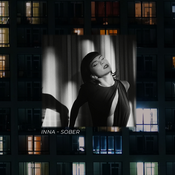 Single cover artwork for "Sober" which sees INNA wearing a black dress and lying back which is hung as a backdrop over a block of flats.