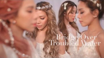 YouTube thumbnail of the video of "Bridge Over Troubled Water" which sees the 4th Impact girls looking like goddesses, dressed all in white.