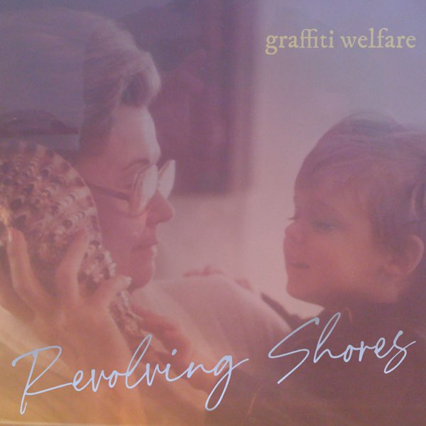 Album artwork of "Revolving Shores" by Graffiti Welfare which shows a faded filtered image of his late grandmother holding a young kid who is his older brother. His older brother is holding a seashell up to his grandmother's ear.
