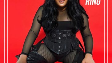 Single cover artwork for "RING RING" which sees BLOOM. crouching in a beautiful black airy catsuit with her hair falling past her shoulders looking slightly like Kim Kardashian. Her hands are on her knees and a bright red block background is behind her. Her name BLOOM. and the title of the song "RING RING" is emblazoned at the top in white.
