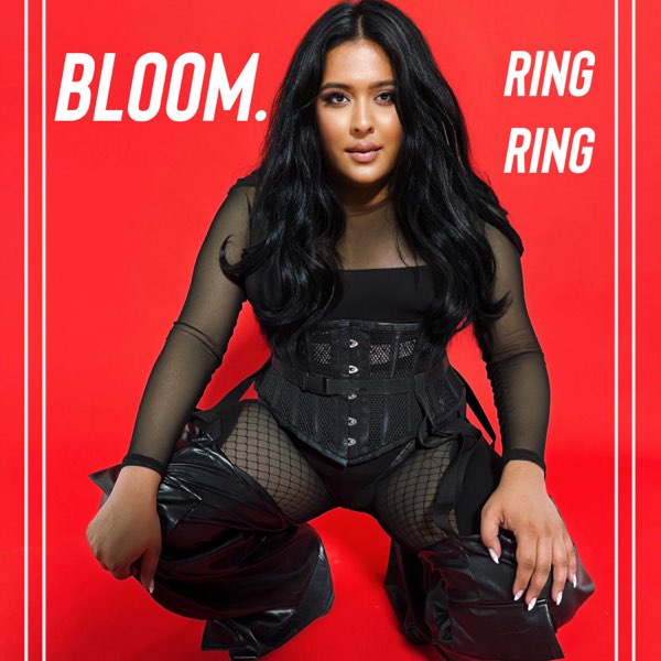 Single cover artwork for "RING RING" which sees BLOOM. crouching in a beautiful black airy catsuit with her hair falling past her shoulders looking slightly like Kim Kardashian. Her hands are on her knees and a bright red block background is behind her. Her name BLOOM. and the title of the song "RING RING" is emblazoned at the top in white.