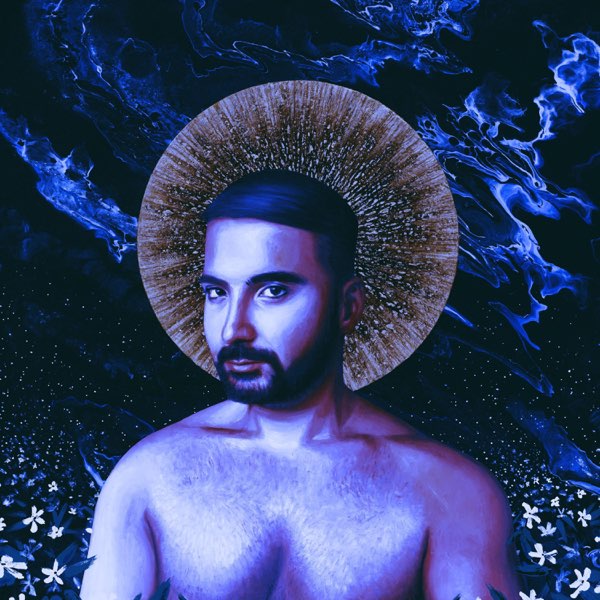 Single cover artwork for "The Free Ones" which sees I, Harappan shirtless with a purple tone over the picture with his head being embellished with a ray of golden light in a halo-like fashion.