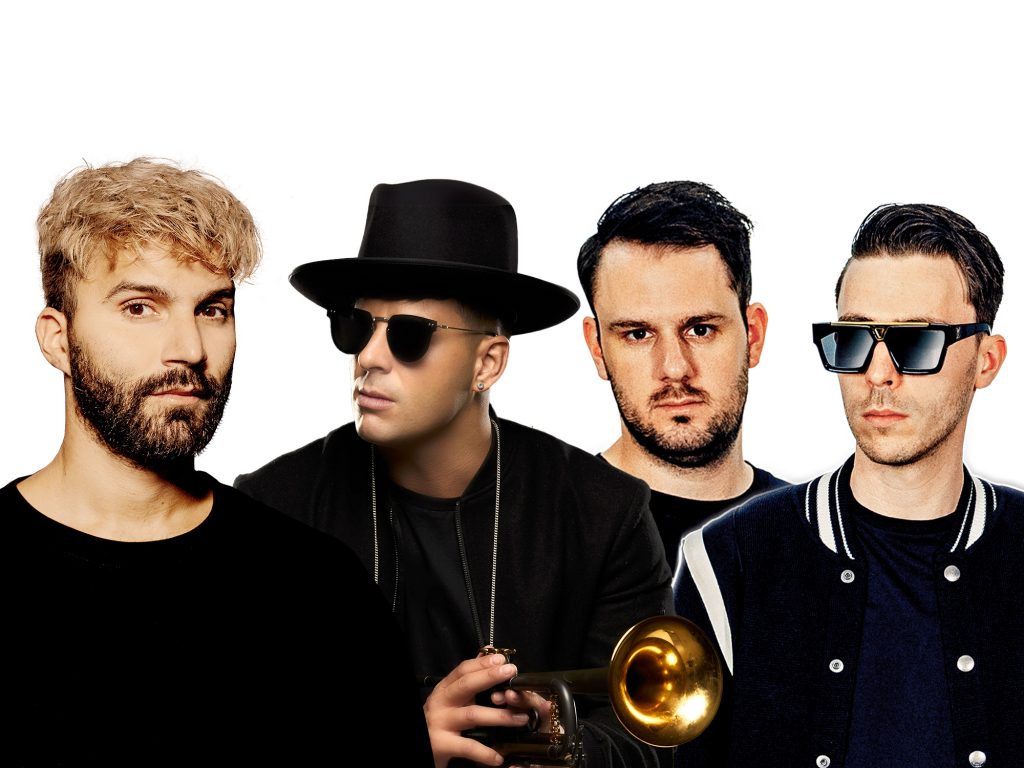 Promotional photo for "Poison" which is an edited photo of all three artists, R3HAB, Timmy Trumpet and W&W all lined up in a row with a white background. They are all wearing black, with R3HAB standing out with his blonde hair and dark beard, Timmy Trumpet is wearing a fedora and sunglasses and he is holding a trumpet, and W&W are wearing varsity jackets.