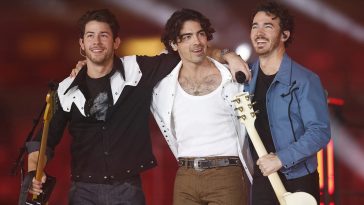 Jonas Brothers performing together in 2022.