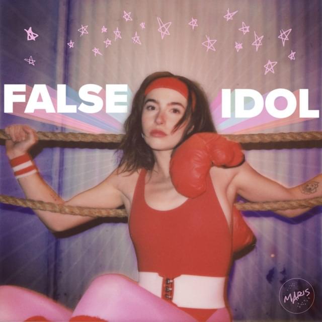 Single cover artwork for "False Idol" which sees MARIS in a red leotard and pink leggings sitting on the side of a boxing arena with her arms hooked over the rope sides.