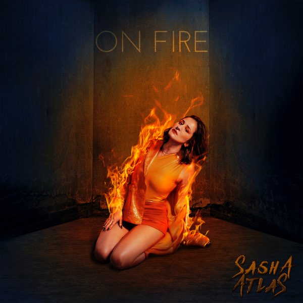 Official EP artwork for "On Fire" which sees Sasha Atlas kneeling down wearing a short red dress and a brown jacket which is lit up in flames.