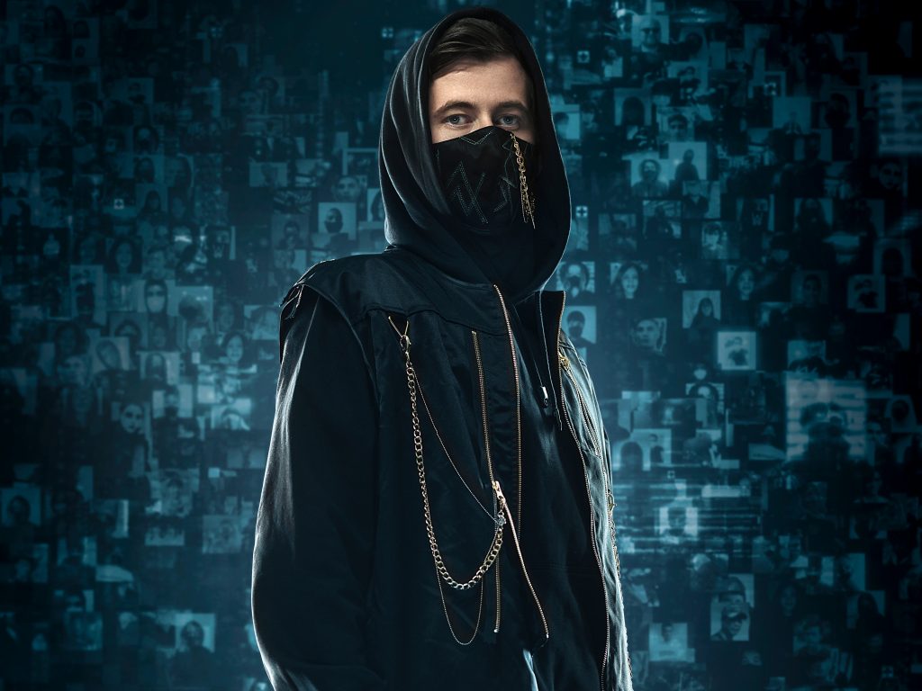 Promotional image for "Dreamer" which sees Alan Walker looking at the camera while wearing a black mask and a black hoodie, which has chains going from his shoulder to half-way up the zip. The background is blue with images of his fans in boxes with a blue colour filter over them, organised in a 3D collage.