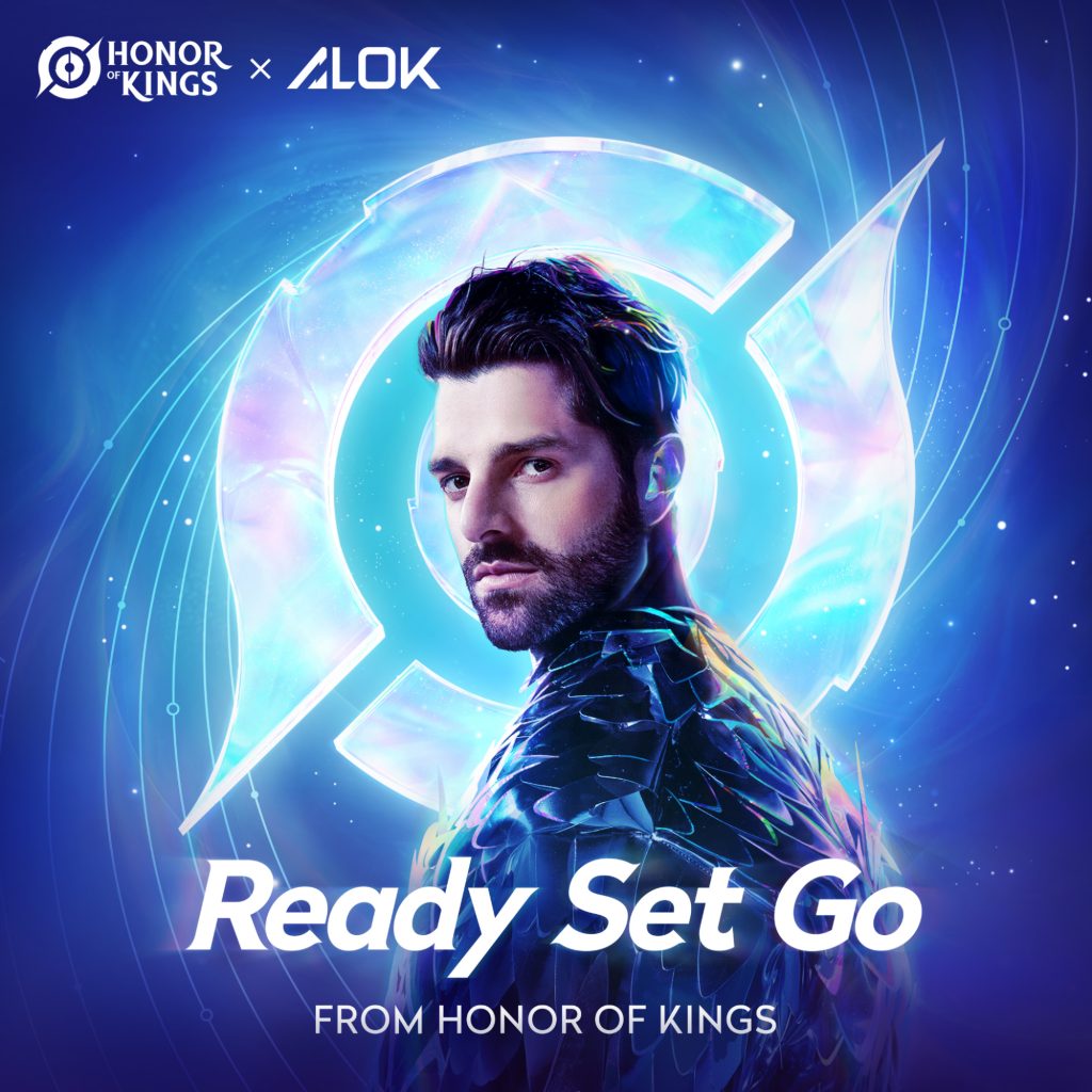 Single cover artwork for "Ready Set Go (from Honor of Kings)" which sees Alok looking over his shoulder at us, wearing a spiky blue metallic jacket with the background blue that centres to light blue with the circular logo of Honor of Kings surrounding the Brazilian DJ.