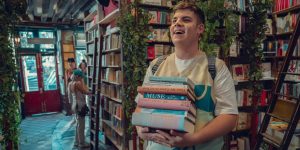 Isaac goes book shopping in Paris (Image: Netflix)