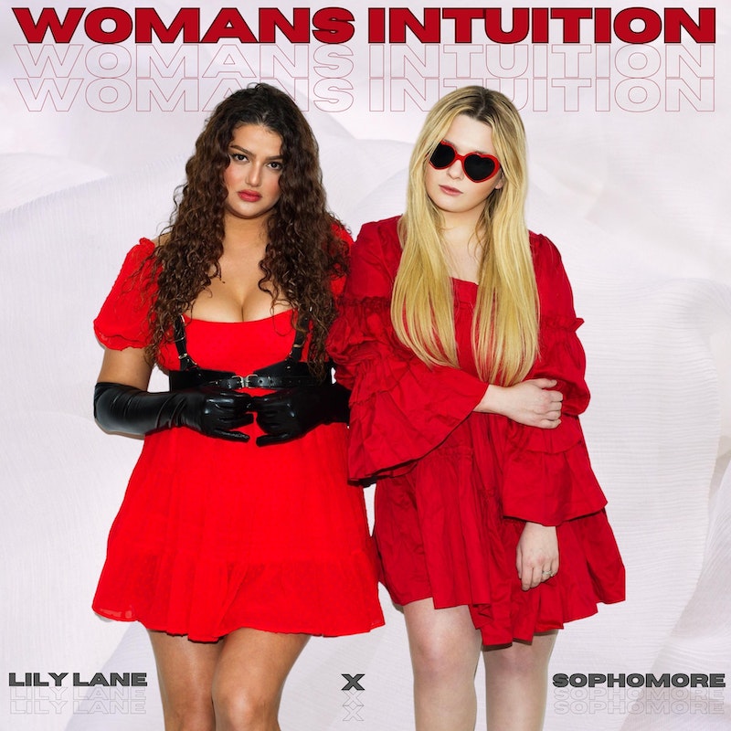 Single cover artwork for "Woman's Intuition", which sees Lily Lane and Sophomore (Abigail Breslin) wearing red dresses, standing next to each other. Sophomore is wearing shades with her blonde hair going past her shoulders, with her right hand held on to her left-arm's elbow. Lily Lane is standing on the left of Sophomore, wearing black gloves and she has long curly brown hair that also goes past her shoulders.
