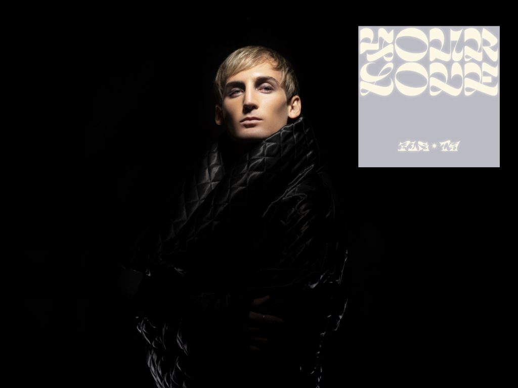 Promotional photo for "Your Love" in collaboration with Sofiya Nzau which sees PLS&TY with his blonde hair, wrapped up in a black puffer coat which matches the background behind him. In the top left corner the single cover artwork is photoshopped into the image, overlaying it. The artwork is lilac with the words of the song and the artists names in squiggly letters.