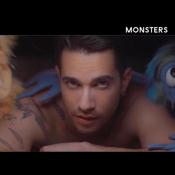 Single cover artwork for "Monsters" which sees Sam J Garfield under the bed with the yellow puppet monster to his right and the purple-blue puppet monster to his left.